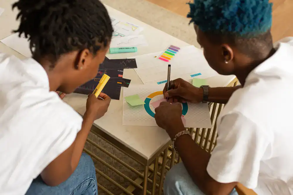 Two developers collaborating over sketches