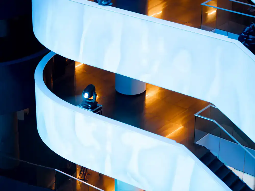 Sleek futuristic platforming level with dynamic lighting