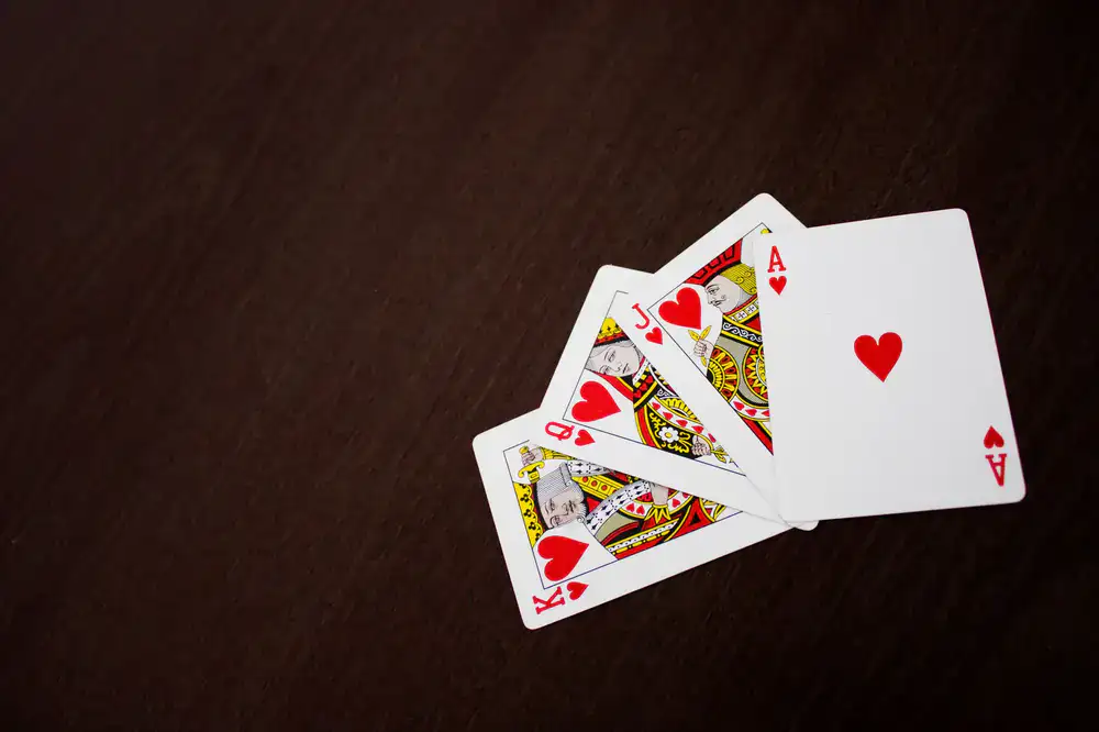 Intricate playing cards laid out on a virtual wooden table